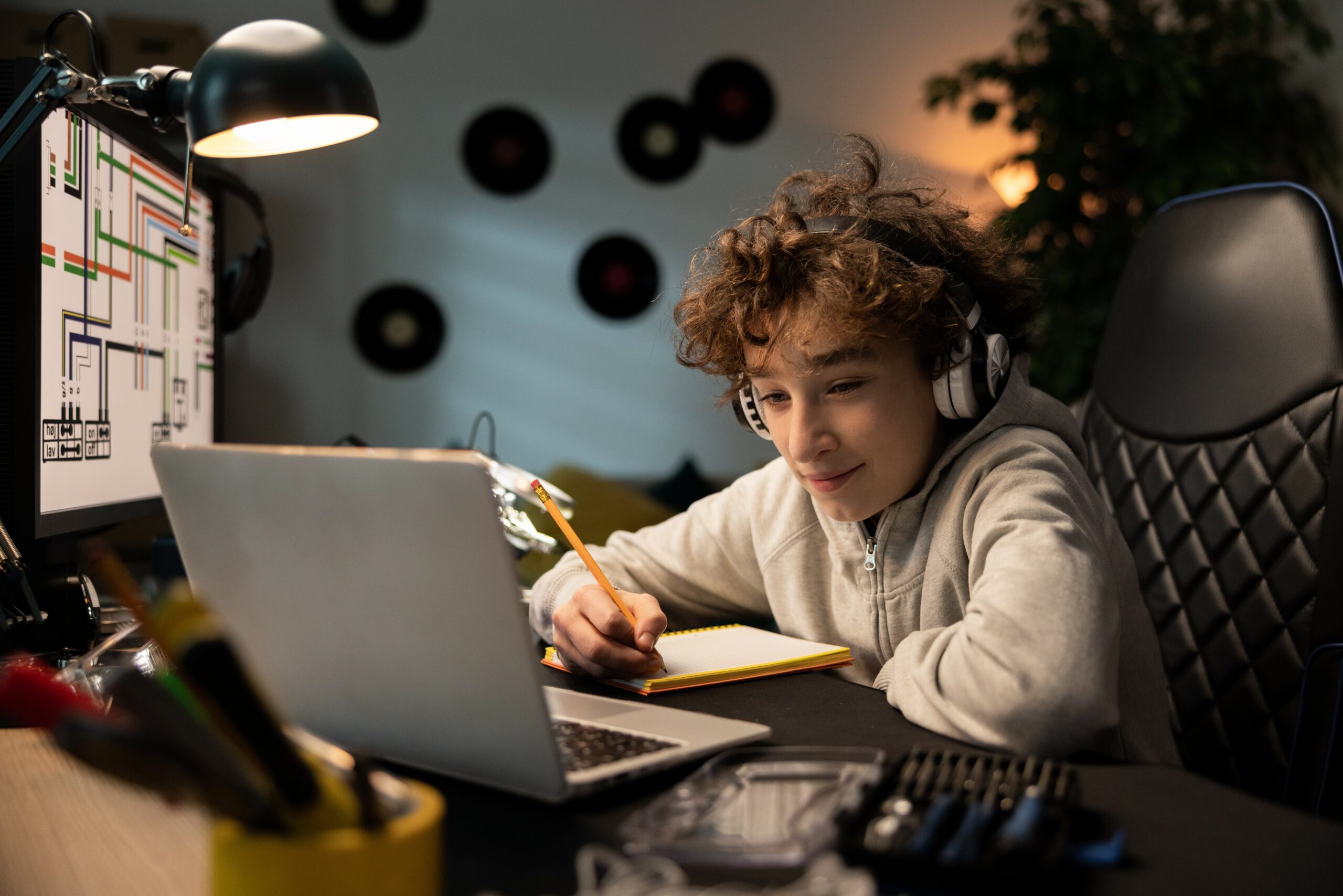 boy image with laptop for design an escape room